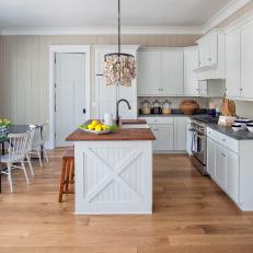 Beige and White Cottage Kitchen With Oyster Shell Pendant