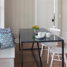 Cottage Breakfast Nook With White Banquette and Navy Table