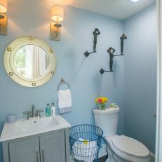 Contemporary Blue Powder Room with Hardwood Brown Floors 