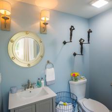 Contemporary Blue Powder room with Gold Mirror 