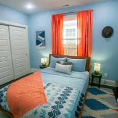 Contemporary Blue Bedroom with Matching Bed Linens and Area Rug 