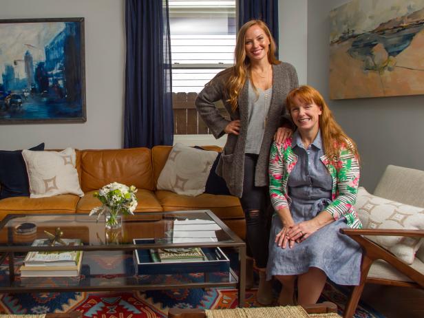 Mina Starsiak (l) and Karen E. Laine (r) pose in the living room of the refurbished home as seen on Good Bones.