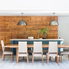 Midcentury-Modern Dining Table Adjacent to Transitional Kitchen