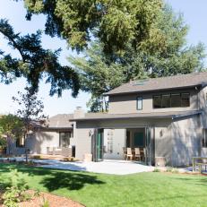 Gray Transitional Home Rear Exterior and Backyard