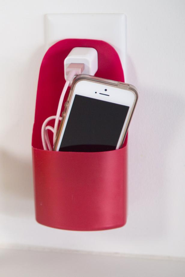 cell phone in a pink plastic holder