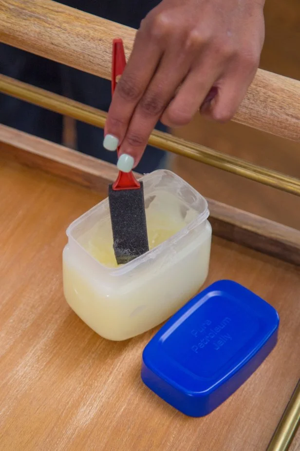 dipping brush in petroleum jelly