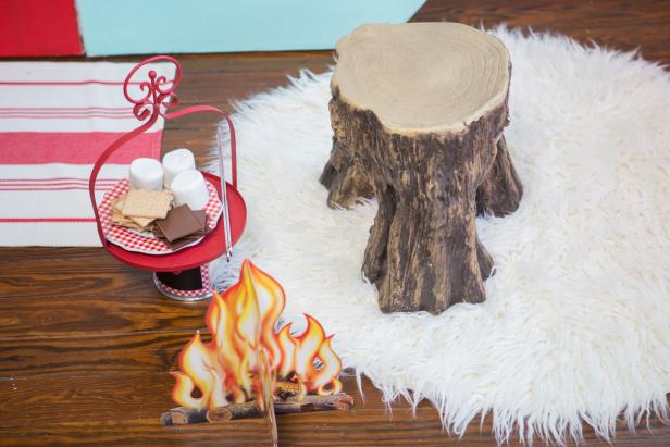 Faux log and a campfire makes indoor s'mores more fun.
