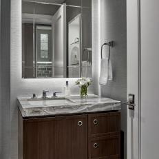 Small Transitional Bathroom Vanity with Warm Wood Base and Thick Pattern Granite Countertop