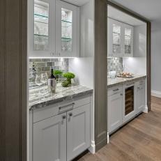 Gorgeous Side-By-Side Built-In Cabinets Featuring Shelf Lighting, Tile Backsplash and Granite Countertop