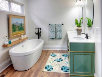 White Bathroom with Green Double Vanity  and White Oversized Tub 