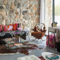 Stone Wall Adds Color and Texture to Eclectic Living Room