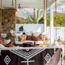 Relaxing Back Porch With Boho-Style Swing Chairs