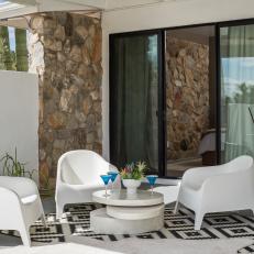 Black-and-White Rugs Soften Outdoor Sitting Area