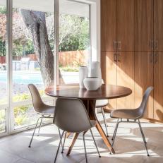 Midcentury Dining Room With Backyard View