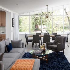 Midcentury Modern Open Living Room With Blue Rug