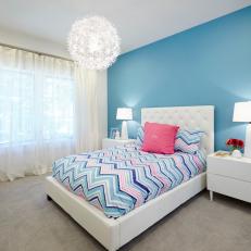 Blue and White Transitional Bedroom With Striped Bed Linens