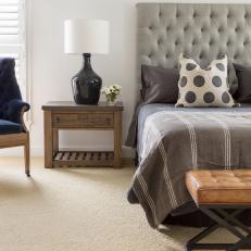 Master Bedroom With Country Nightstand and Tufted Headboard
