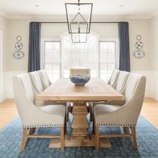 Gray Dining Room With Wood Table and Blue Accents