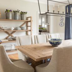 Gray Dining Room With Wood Table and Open Shelving