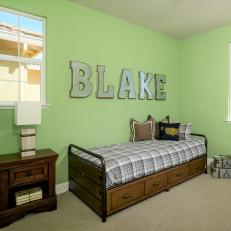 Kid's Green Country-Style Room With Name on Wall