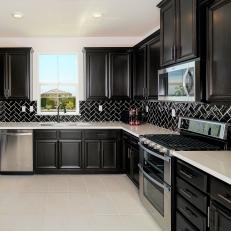 Beautiful Black Kitchen With Hints of Pink