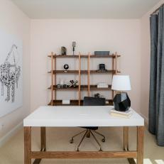 Uncluttered Pale Pink Home Office With Music-Themed Art