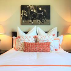 Guest Room With White Bed and Horse Race Artwork