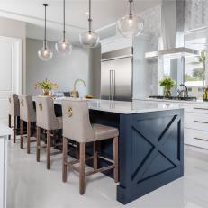 Oversize Blue Island in White Kitchen With Pendant Lights