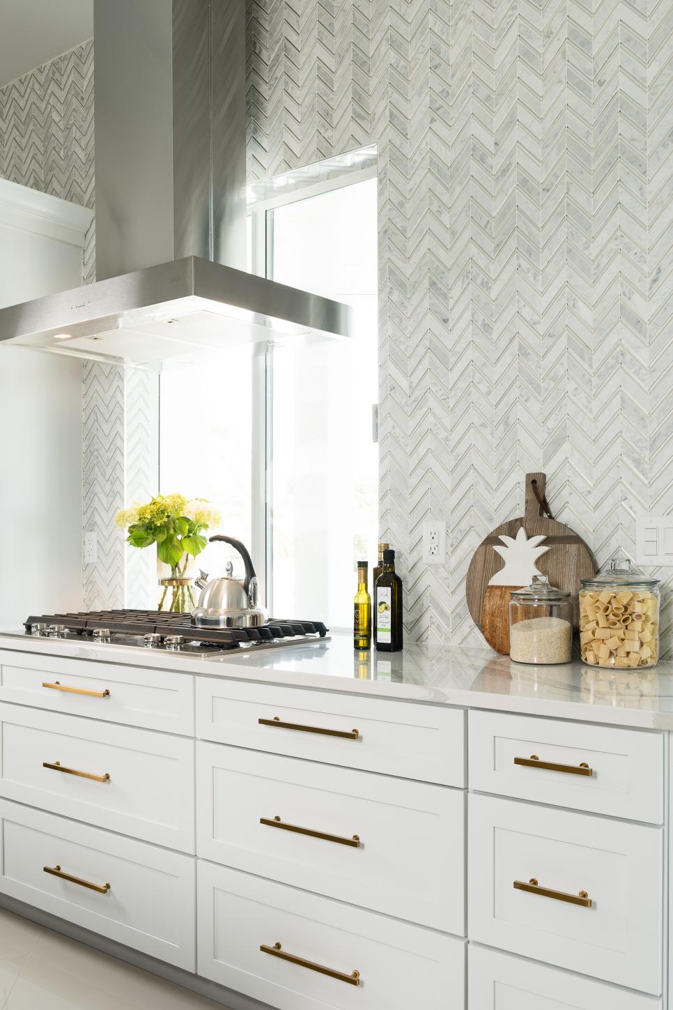 Herringbone Backsplash Behind White Drawers, Gold Hardware | HGTV