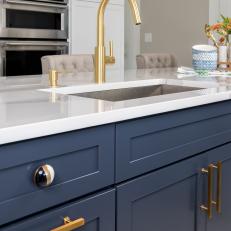Curved Faucet in Blue Kitchen Island With Quartz Countertop