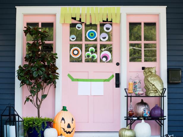 Create some googly curb appeal with a mischievous monster door. Simple cardstock, crepe paper, and tape can make a creative funky face for your front door.