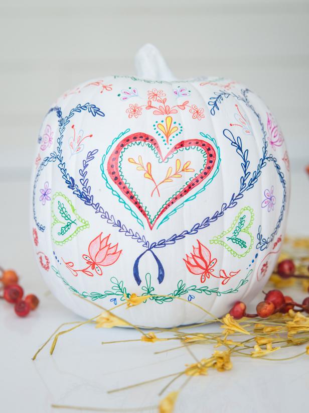 This no-carve pumpkin is a playful, untraditional take on a painted pumpkin.  Get the kids involved, let loose and have fun creating your own folky design.
