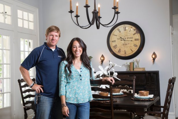Portrait of Hosts Chip and Joanna Gaines in the dining room at the Hendricks' home, that they've just renovated, as seen on HGTV's Fixer Upper. (camera aware)