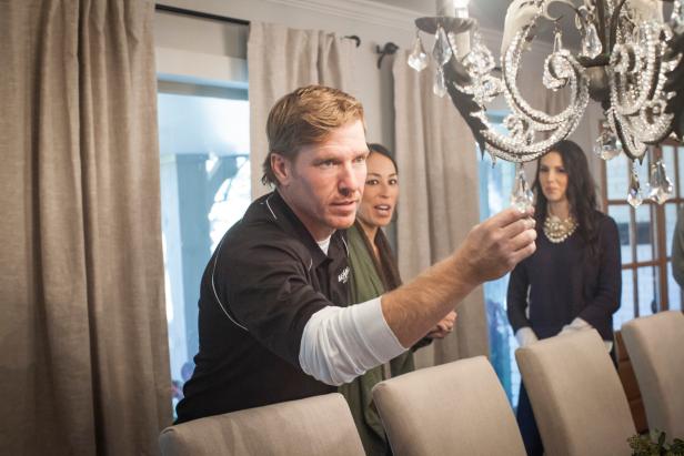 As seen on Fixer Upper, Chip Gaines admire's the chandelier in the Reed's newly renovated dining room.