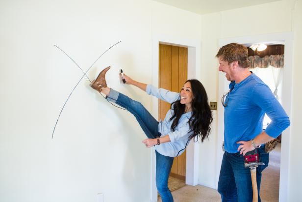 Hosts Chip and Joanna Gaines mark which walls are going to be torn down in the Eberle home, as seen on Fixer Upper. (working)