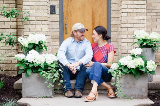 As seen on Fixer Upper, Chip and Joanna Gaines outside the Hardy's remodeled home. (Portrait)