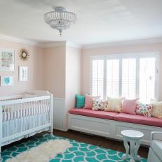 Pink and Blue Transitional Nursery With Sheepskin
