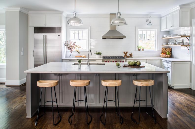 White Kitchen With Gray Island and Chrome Pendants