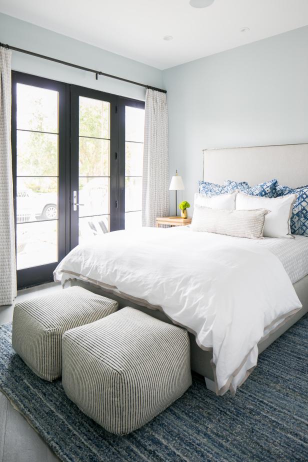 Black French Doors Bring in Natural Light to Warm This Neutral Bedroom ...