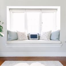 Window Seat With Blue Pillows