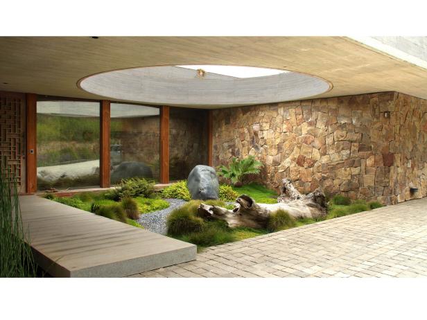 Contemporary Courtyard with Driftwood, Boulder and Stone