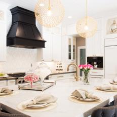 White Eat-In Kitchen With Gold Pendants