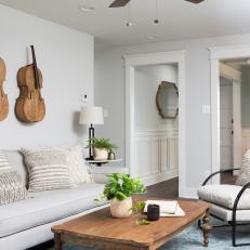 White Traditional Living Room with Mounted Cellos 