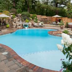 Pool and Patio With White Flowers