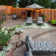 Patio With Black and White Lounge Chairs