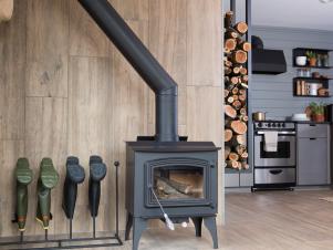 Neutral Foyer with Black Wood Burning Stove and Boot Rack