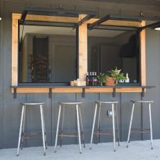 Contemporary Black Bar with Metal Barstools 