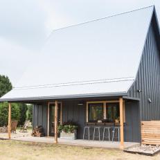 Contemporary Black Cabin with Wood Details