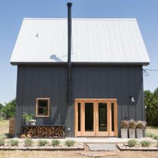 Black Cabin Exterior with Metal Roof 
