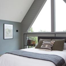 Contemporary Gray Bedroom with Vaulted Ceilings 